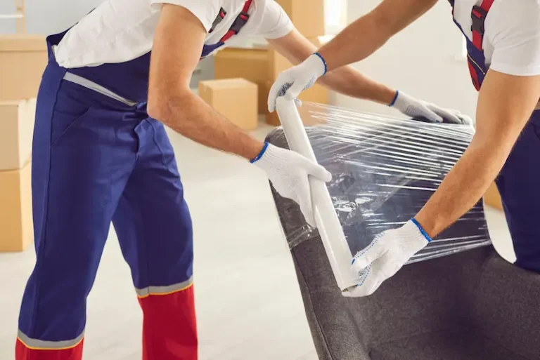 Trained movers carefully packing items for moving