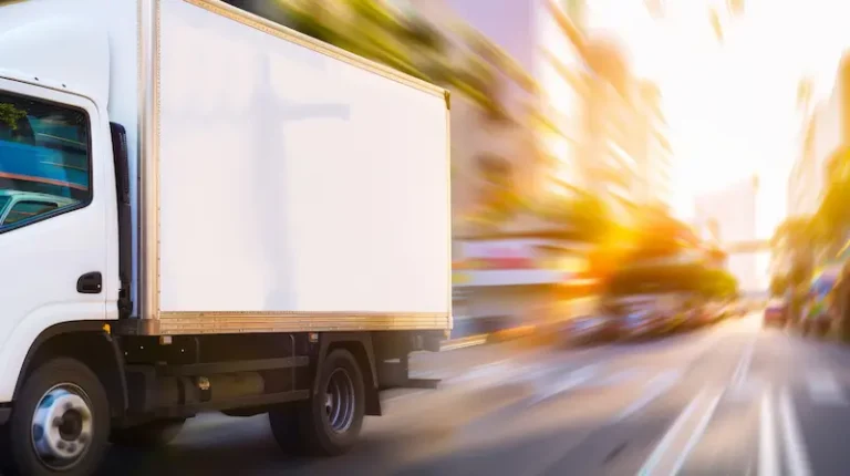 A moving truck transporting items in the city